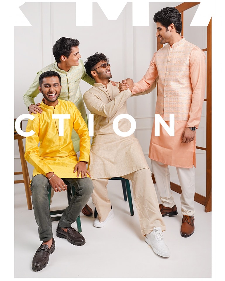 Group shot of three male models laughing and interacting, wearing traditional kurtas in yellow, beige, and peach, showcasing festive ethnic wear.