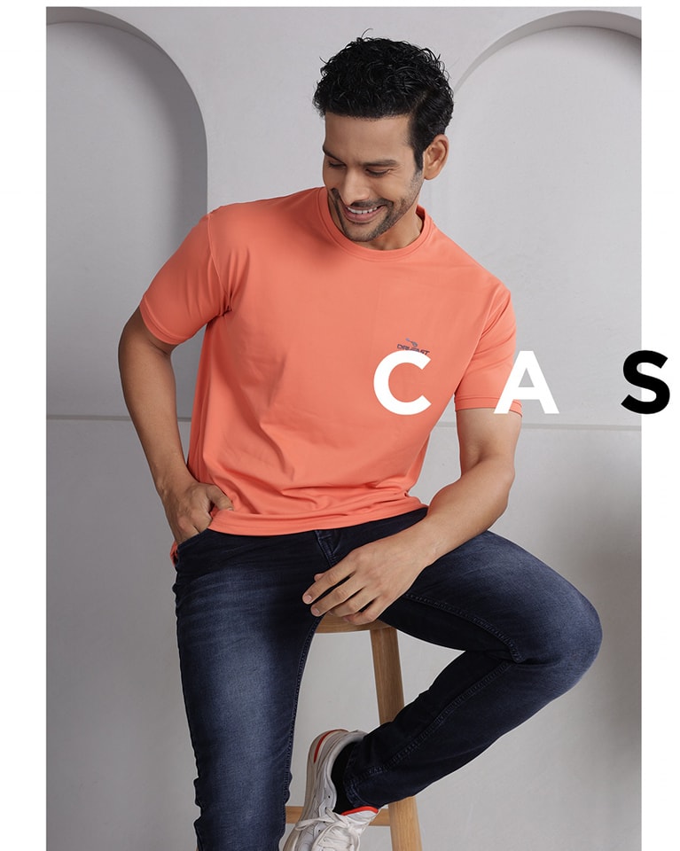 Fashion campaign collage for Cambridge Men’s Wear featuring four distinct looks: peach and blue casual t-shirts, a green polo with a duffel bag, and a group shot in traditional ethnic kurtas. The text overlay reads 'CASUAL PERFECTION'.